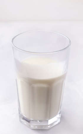 Fermented milk drink kefir on a white background. Vertical photoの写真素材