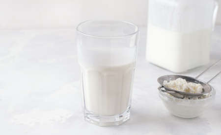 Fermented kefir in a glass on a white background. Dairy foodの写真素材