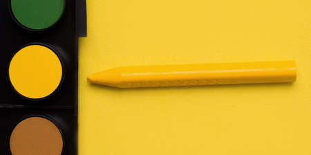 Drawing concept. Yellow. Crayons and paintsの写真素材