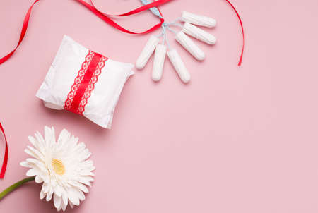 Menstruation concept. Panty liners and tampons on a pink background. Copy space.の写真素材