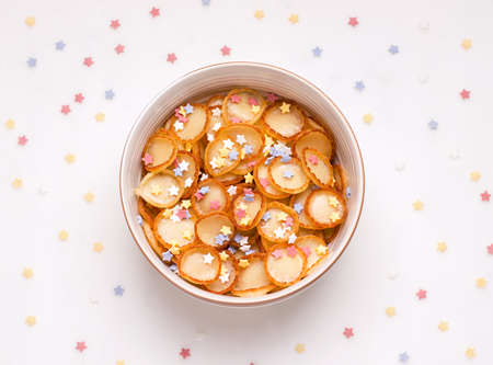 breakfast sweet tiny pancake cereal on a white backgroundの写真素材