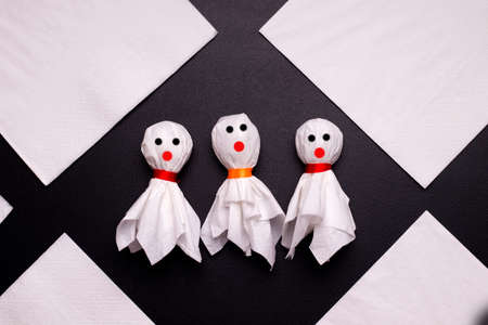 DIY Halloween candy ghost step by step. Image four. Draw ghosts eyes and mouth. Done