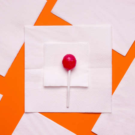DIY Halloween candy ghost step by step. Image two. Put a smaller square on a large napkin and candy on itの写真素材