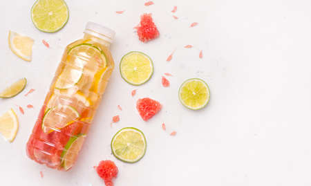 Isotonic sports drink with lemon and grapefruit on a white background. Banner. Copy spaceの写真素材