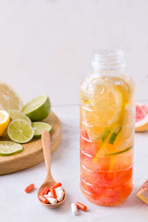 Fortified drink with citrus in a bottleの写真素材