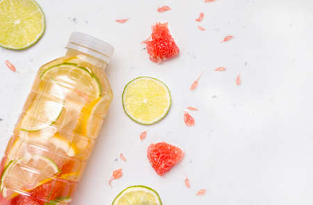 Sports isotonic drink with citrus closeup on a white background. Copy spaceの写真素材