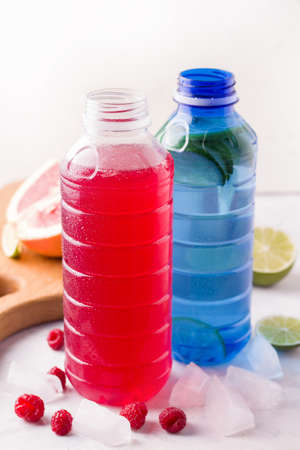 Chilled isotonic sports drinks with lime and raspberryの写真素材