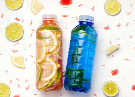 Bottled isotonic sports drink on white background.の写真素材