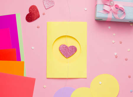 Happy Valentine's Day diy postcard step by step. Step three, place the object with thread on top of the cut out circle, from the outsideの写真素材