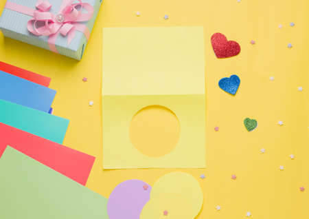 Diy card with a rotating heart for the holiday step by step. Step one fold a piece of paper in half and cut a circle on one sideの写真素材