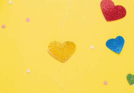 Diy card with a rotating heart for the holiday step by step. Step three from above on the thread, glue the second side of the heart figurineの写真素材