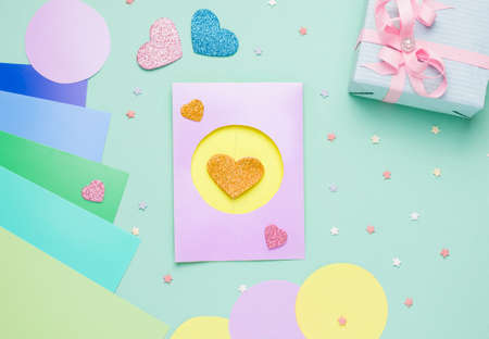 Diy card with a rotating heart for the holiday step by step. Step five. Cover the top of the card with a piece of cardboard identical to the outside of the card.の写真素材