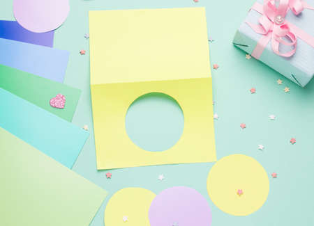 Diy card with a rotating heart for the holiday step by step. Step one fold a piece of paper in half and cut a circle on one side.の写真素材