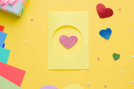Diy card with a rotating heart for the holiday step by step. Step four. Place a sealed heart inside the circle on the outside of the cardの写真素材