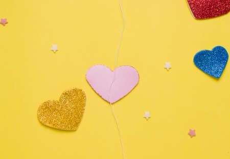 Diy card with a rotating heart for the holiday step by step. Step two glue the thread on the heart on the figure that will rotateの写真素材