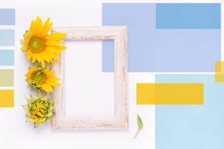 Summer Mood Board with sunflower flowers and wooden frame in yellow-blue colorsの写真素材