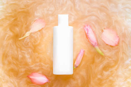 Mockup bottle in white on shimmer surface. Cosmeticsの写真素材