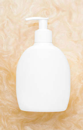 Mockup of cosmetic products. White bottle with shiny water dispenser. Vertical photoの写真素材