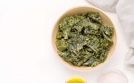 Kale chips on a white background. Copy spaceの写真素材