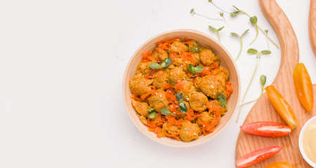 Dish of vegetarian soy meat with micro greens on a white plate. Copy space, bannerの写真素材