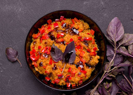 Vegetarian soy meat dish with basil and pepper on a black background.の写真素材