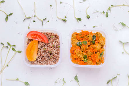 Vegetarian food delivery concept. Soy meat with vegetables and porridge with tomato on a white background top view.の写真素材