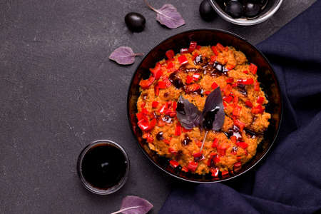 Dish of soy meat with vegetables on a black background. Copy spaceの写真素材