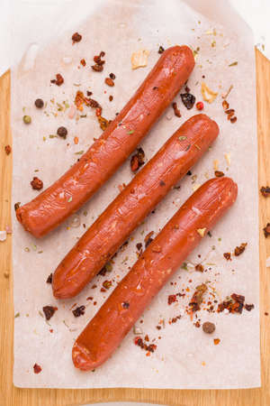 Vegetarian soy sausages close-up on baking paper. View from aboveの写真素材