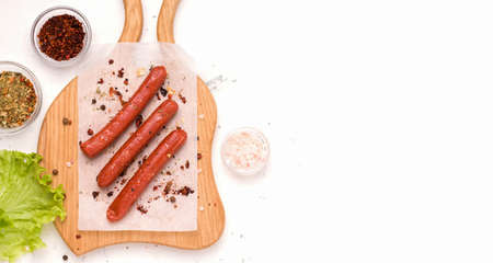 Vegan food product concept. Sausages from soy meat on a white background. Copy space. View from aboveの写真素材