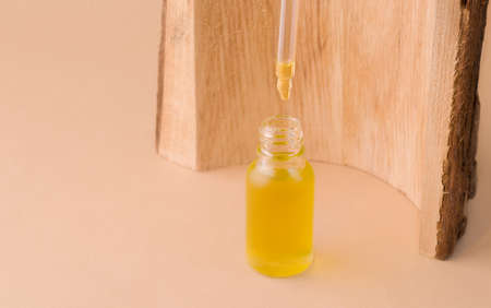 Cosmetic organic oil for face and body care in a matte bottle with a dropper.の写真素材