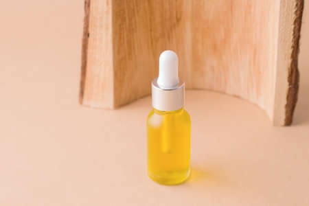 Cosmetic organic oil for face and body care on beige backgroundの写真素材