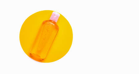Mock up orange shower gel on a white background. Copy spaceの写真素材