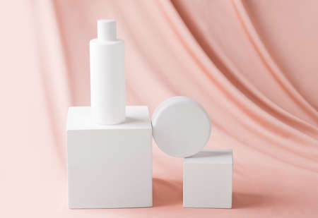 Mock up of a set of cosmetics on a beige fabric background.の写真素材