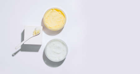 Cosmetics geometry. Body scrub on a white background. View from above. Copy space. Bannerの写真素材