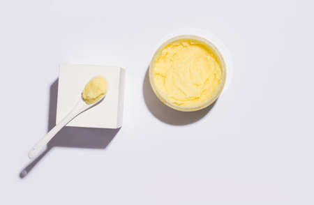 Cleansing scrub yellow. View from above. White background. Copy spaceの写真素材