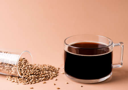 Decaffeinated coffee drink made from cereals on beige backgroundの写真素材
