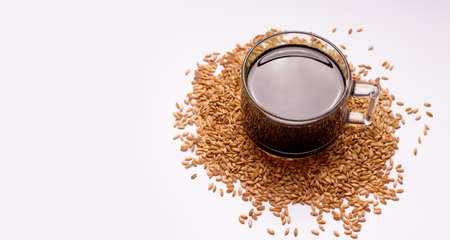 Decaffeinated coffee substitute made from oats on a white background. Copy space.の写真素材