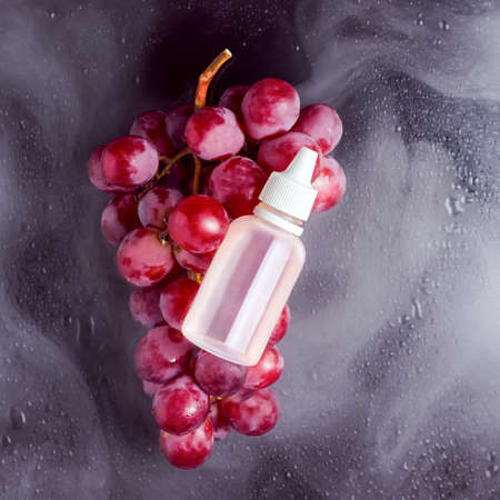 Liquid for vape in a white bottle. Electronic Cigaretteの写真素材