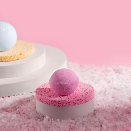 Pink bath bombs in salt. Copy spaceの写真素材