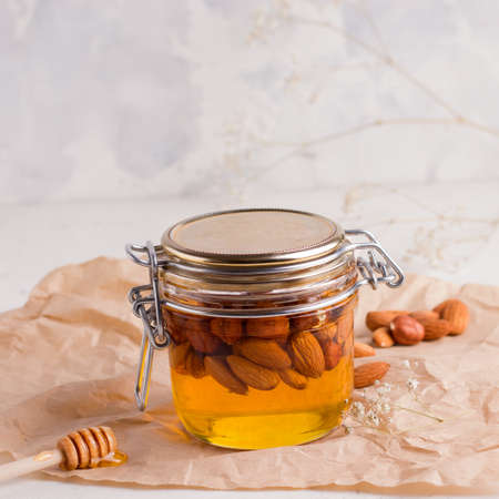 Homemade honey in a jar on a white background.の写真素材