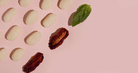 Italian food. Gnocchi traditional vegetarian dish pattern on a pink background. Copy spaceの写真素材
