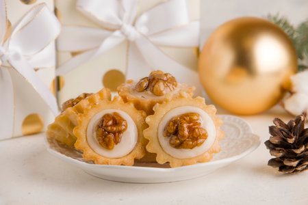 Christmas sweet cookies with nuts and cream on a white background. Festive foodの写真素材