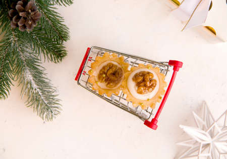New year shopping concept. Sweet biscuits on a cart. View from aboveの写真素材