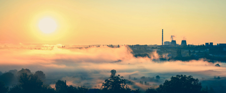 panorama, power station and sunrise with the mist filterの写真素材
