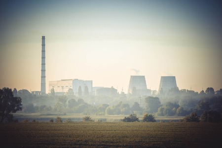 thermal power station with three pipes on the close, cloudless sky, the filterの写真素材