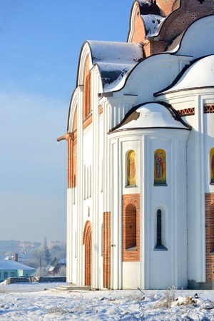 side of the facade of the church of white brightly lit by the sunの写真素材
