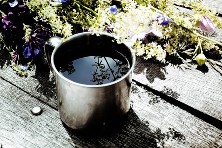 mug of liquid iron on the wooden tableの写真素材