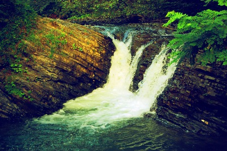 small waterfall in the mountains, the rocks of the Carpathians, Ukraineの写真素材