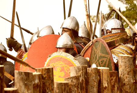 Samara, Russia, the festival of historical reconstruction ancient Russia ages 11-13 - August 16, 2013: many soldiers with shields ready to attack in historical dress on the festival of historical reconstruction of life of the ancient Kievan Rusのeditorial素材