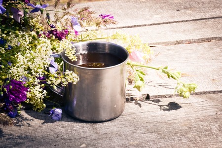 mug is on the table with spring flowers filterの写真素材